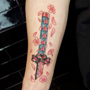 cherry blossom katana hilt tattoo by Yara Verhoeve