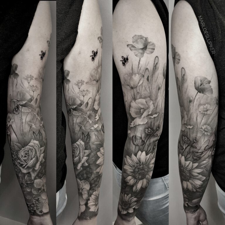 floral sleeve in black and grey tattoo style by Marloes Lupker