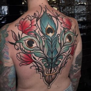 Peacock Feather cover-up back piece with flowers in neotraditional ornamental style by Marloes Lupker