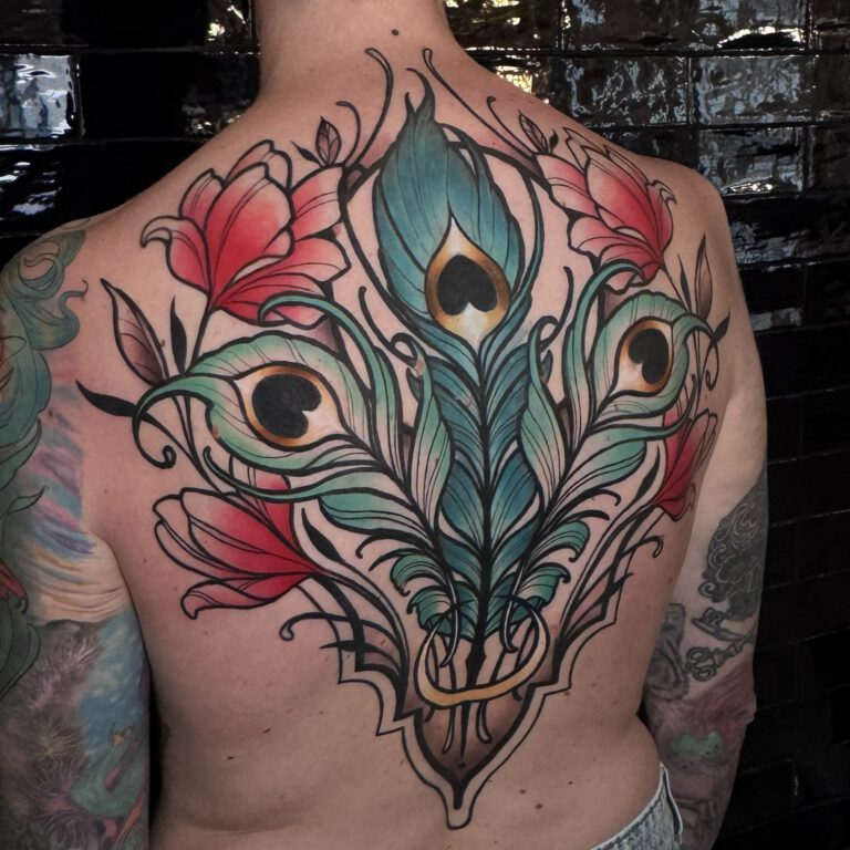 Peacock Feather cover-up back piece with flowers in neotraditional ornamental style by Marloes Lupker