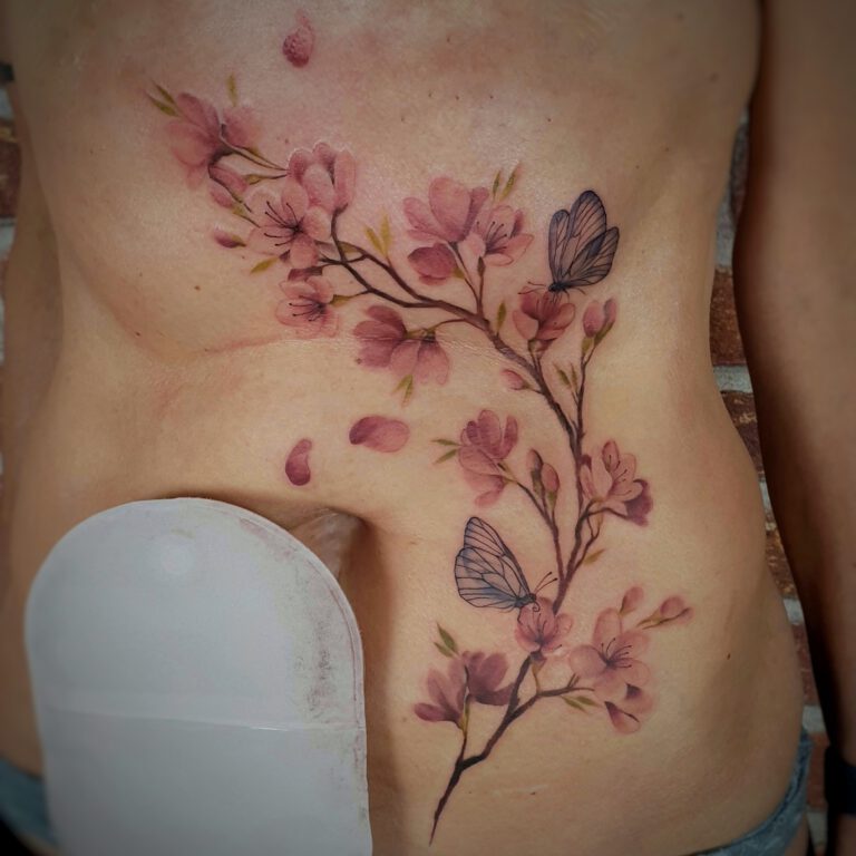 soft color shading cherry blossom tattoo by Marloes Lupker