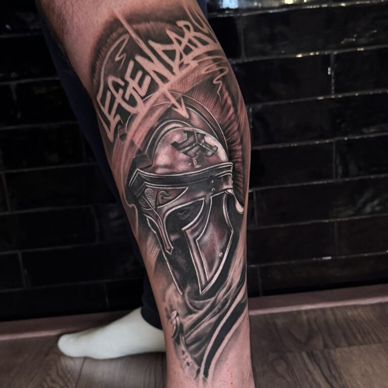 spartan warrior tattoo in black and grey realistic tattoo style by Marloes Lupker
