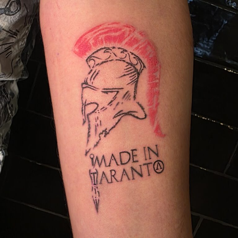 spartan helmet tattoo by Kjell Ziesemer Tattoo Artist